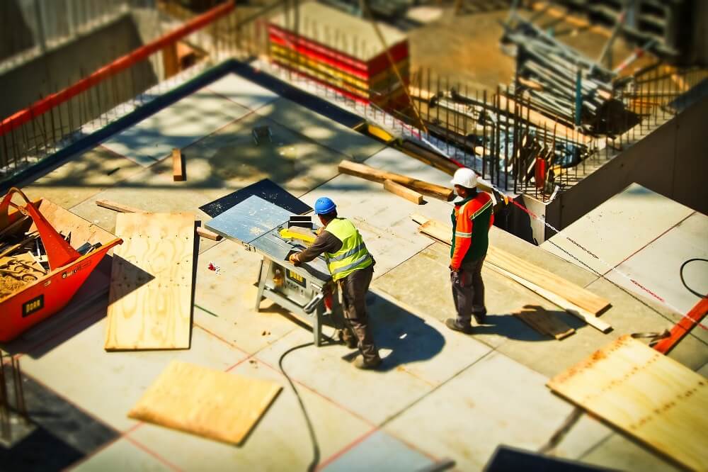 A construction site with two builders