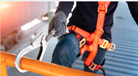 A person safely hooked on to a rail